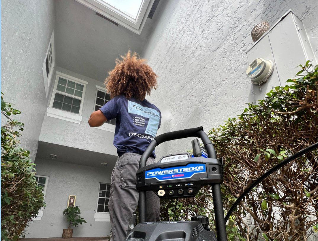 Soft-wash cleaning of a stucco exterior in Boca Raton, FL